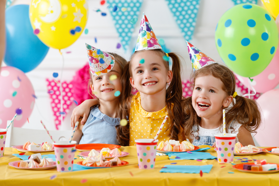 Girls smiling at birthday party at Celebrate You